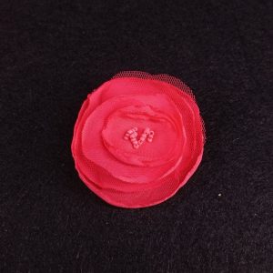 Flor tela niña pelo con pinzas coral