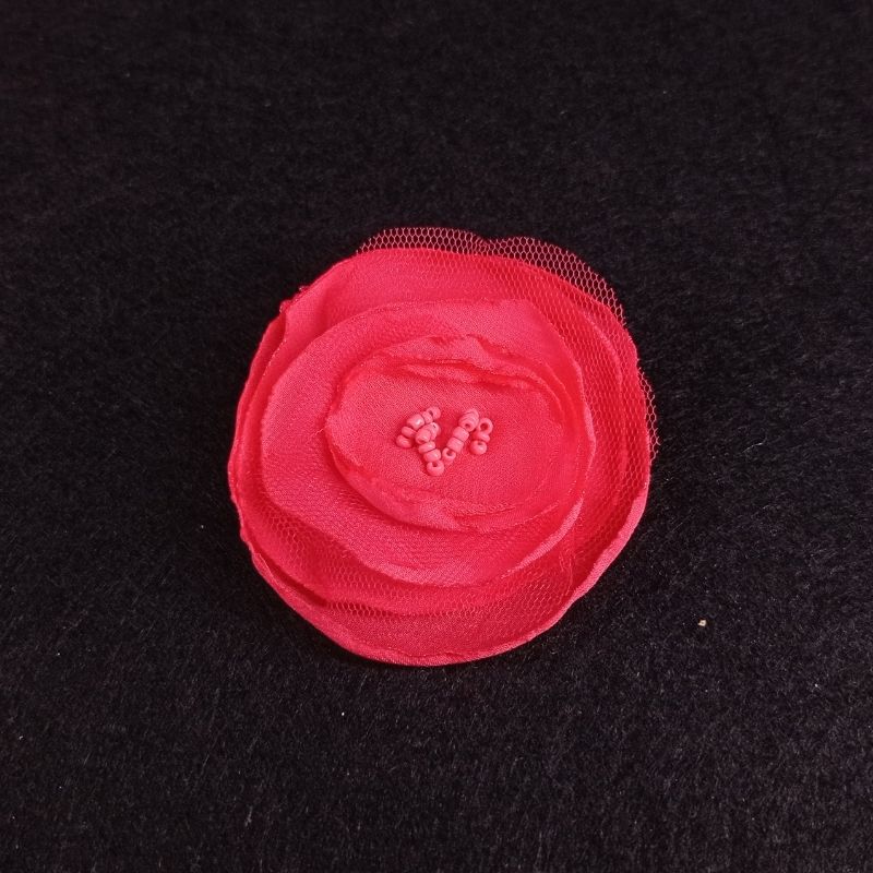 Flor tela niña pelo con pinzas coral