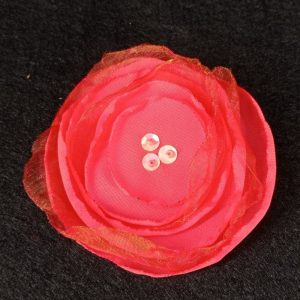 Flor tela coral con lentejuelas