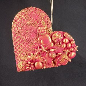 Corazón con abalorios con elefante