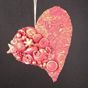 Corazón con abalorios con sol